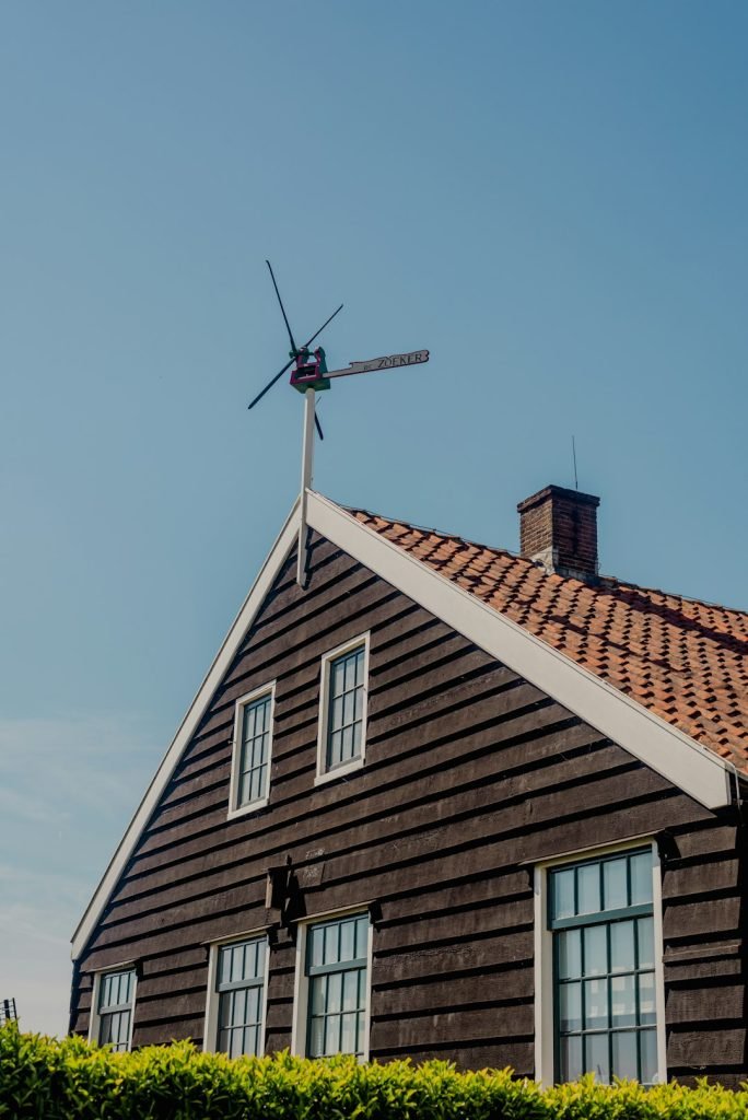 a-house-with-a-windmill-on-top-of-it-kseuc-ubsuo a-house-with-a-windmill-on-top-of-it-kseuc-ubsuo